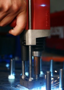 Stud welding can be performed with a hand tool that is brought to the material. Photo courtesy of Nelson Stud Welding.